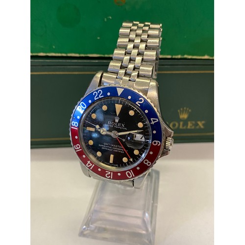 210 - A gentleman's Rolex GMT wristwatch reg.design 1675, 1308253, in a stainless steel case, on a stainle... 