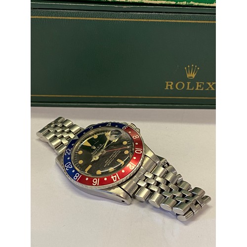 210 - A gentleman's Rolex GMT wristwatch reg.design 1675, 1308253, in a stainless steel case, on a stainle... 