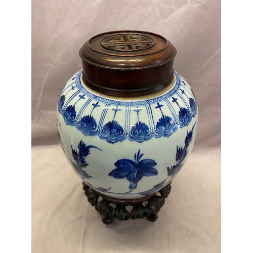 141 - An 18th Century Chinese porcelain ginger jar decorated in under glazed blue and white with flowers a... 