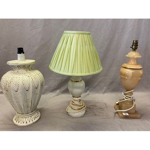 21 - A pink alabaster tablelamp base, a cream alabaster tablelamp base and one other tablelamp base with ... 