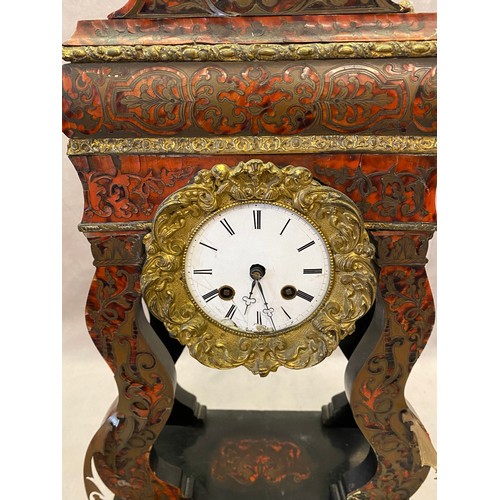 57 - A French Portico style clock with white enamel dial, the case with red Buhl front, on rectangular ba... 