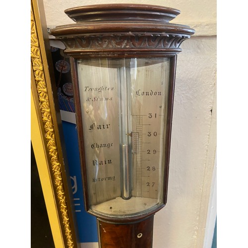 32 - A Georgian stick barometer by Troughton and Simms of London in a mahogany case