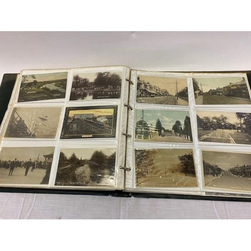 30 - A green postcard album containing three hundred and twelve coloured and black and white postcards of... 