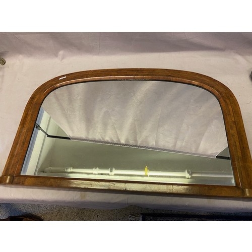 54 - A Victorian overmantel in a walnut veneered and crossbanded frame - 21in. x 35in.