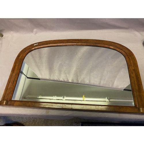 58 - A Victorian overmantel in a walnut veneered and crossbanded frame - 21in. x 35in.