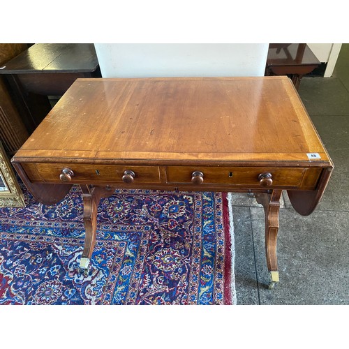 48 - A Regency mahogany and satinwood banded sofa table with rectangular top, two rounded drop flaps, two... 