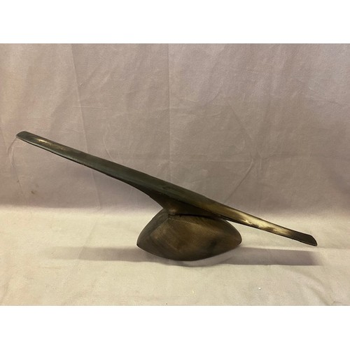 240 - A metal abstract sculpture - 10in. high and 21in. wide