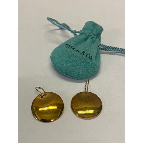 216 - A pair of 18ct. gold  Tiffany disc earrings by Elsa Peretti with pouch and original box