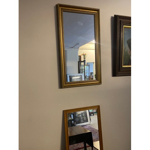 43 - A rectangular wall mirror in a plain gilt frame - 27in. x 15in. and a modern rectangular wall mirror... 