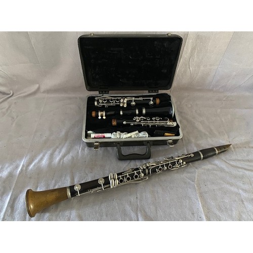 329 - A vintage Besson London wooden and bakelite clarinet with metal fittings - 26 1/4in. long and a Buff... 