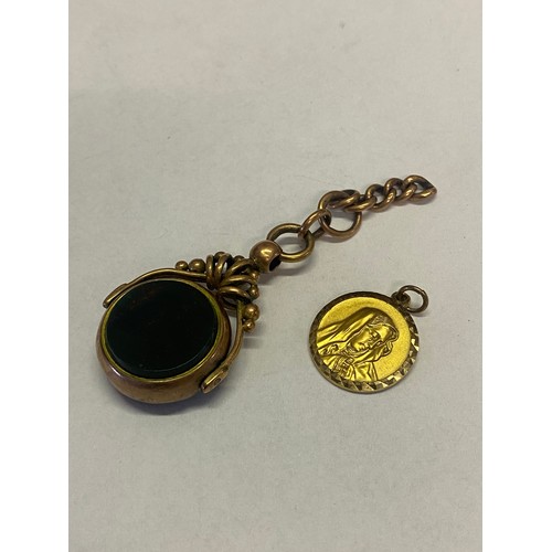 284 - A watch fob swivel set with bloodstone and agate in a 9ct. rose gold frame and a 9ct. gold pendant d... 