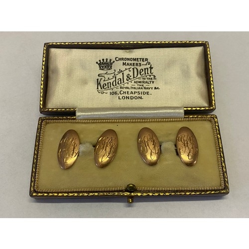 292 - A pair of oval 9ct. rose gold cufflinks in Kendal and Dent leather covered fitted box