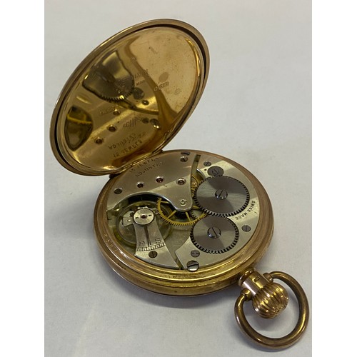 293 - A gentleman's openface pocket watch, white enamel dial, seconds dial, in a 9ct. gold case