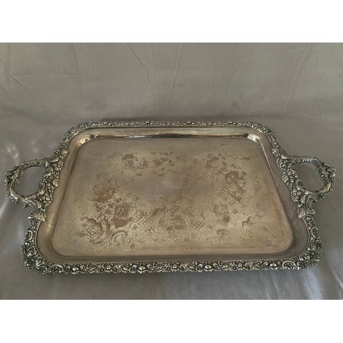 202 - A large Sheffield plate on copper double handled tray - 27in. long and 16in. wide