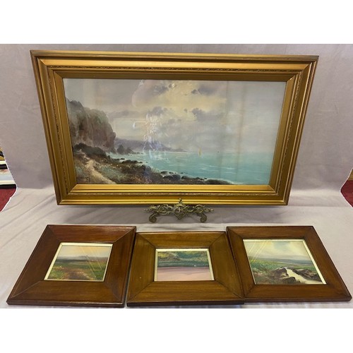 13 - Ronald Ray.  A signed oil - Coastal scene with sheep and cliffs, under a stormy sky, framed and glaz... 