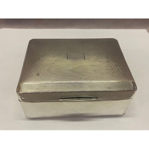 212 - An engine turned silver covered cigarette box with vacant cartouche to the lid - Birmingham 1931, ma... 