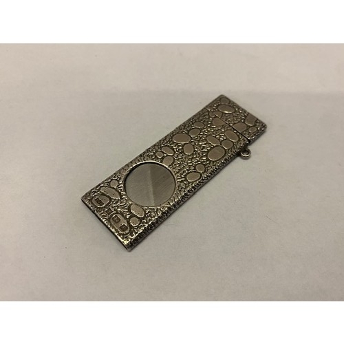 224 - A silver cigar cutter with pebble decoration - Birmingham 1976, makers marks for S J Rose & Son