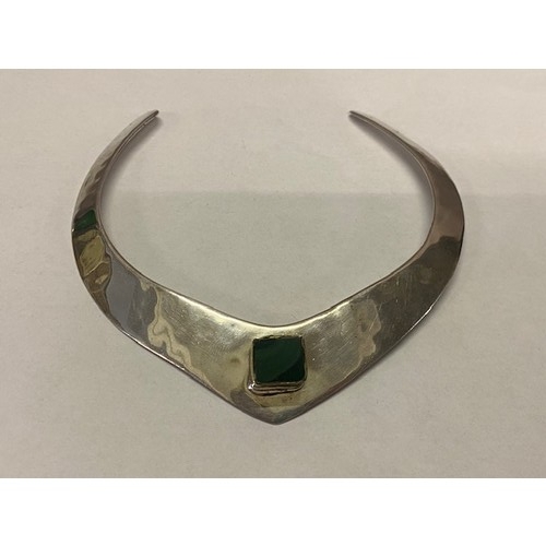 299 - A silver neck collar with inset malachite