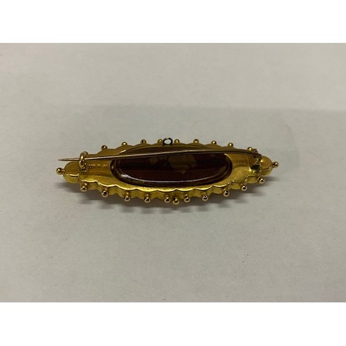 301 - A Victorian 9ct. gold brooch of lozenge design set to the centre with sapphire and seed pearls