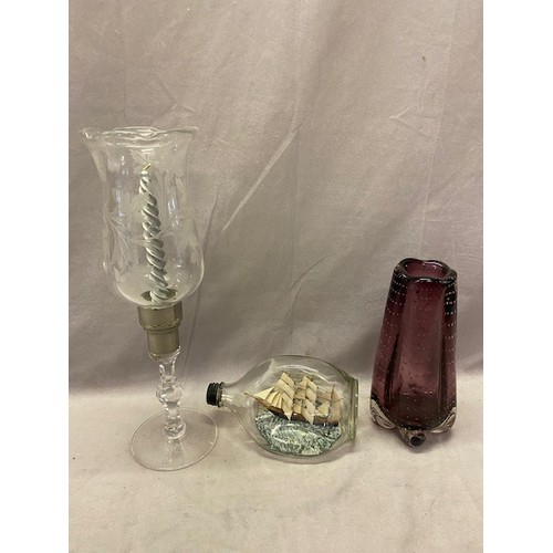 168 - A ship in a bottle, a Whitefriars purple vase and a candleholder with etched leaf decoration