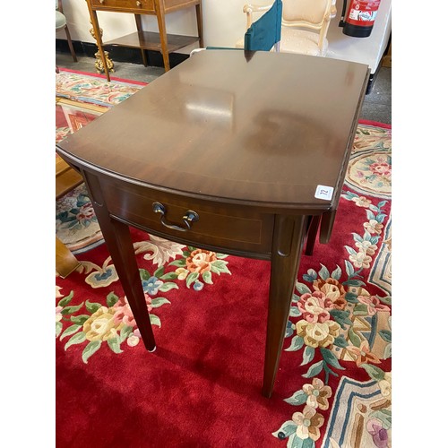 29 - A reproduction mahogany Pembroke table fitted two rounded drop flaps, end drawer, on square tapered ... 