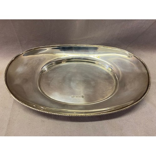 235 - An oval silver bread dish with gadroon border - Birmingham 1995, makers marks for Barker Ellis Silve... 