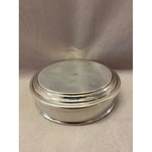 236 - An Asprey oval plain silver trinket box with red velvet lining - Birmingham 2001 - 5in. x 4in.