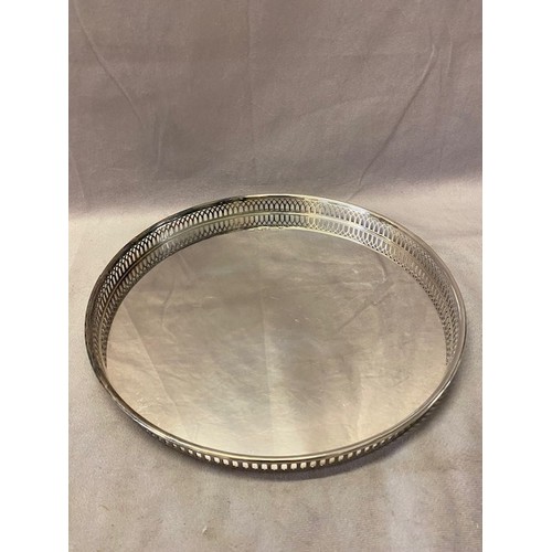 238 - A circular silver tray with saw pierced border - Birmingham 1994, makers mark for Barker Ellis Silve... 