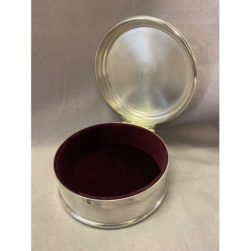 244 - An Asprey and Garrard circular plain silver trinket box with stepped hinged lid, burgundy velvet lin... 