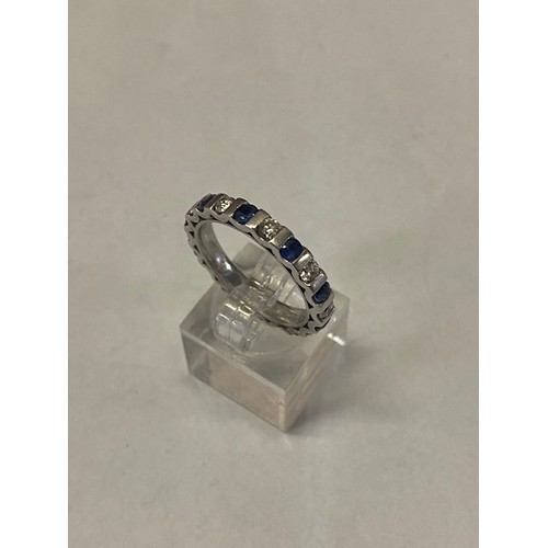 310 - A Platandia full eternity ring set alternate sapphires and diamonds, on an 18ct. white gold shank