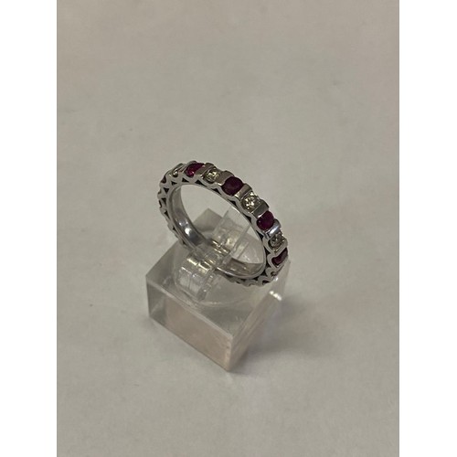 312 - A Platandia full eternity ring set alternate rubies and diamonds, on an 18ct. white gold shank