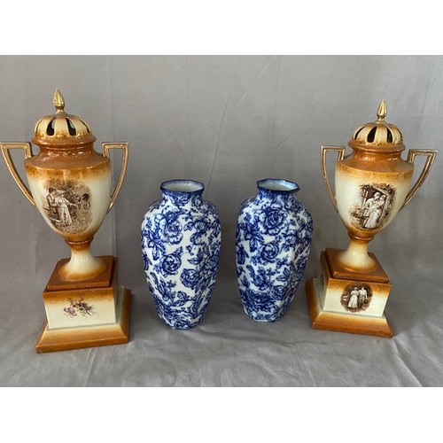 109 - A pair of Losolware blue and white panelled vases decorated flowers - 11 1/2in. high and a pair of E... 