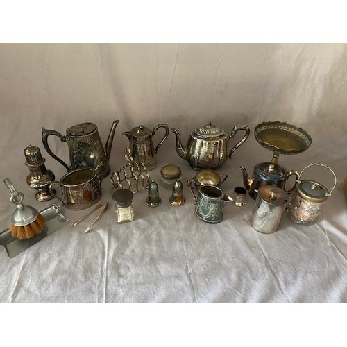 144 - A selection of silver plate including a toastrack, coffee pot, hot water jug, toilet jar with silver... 