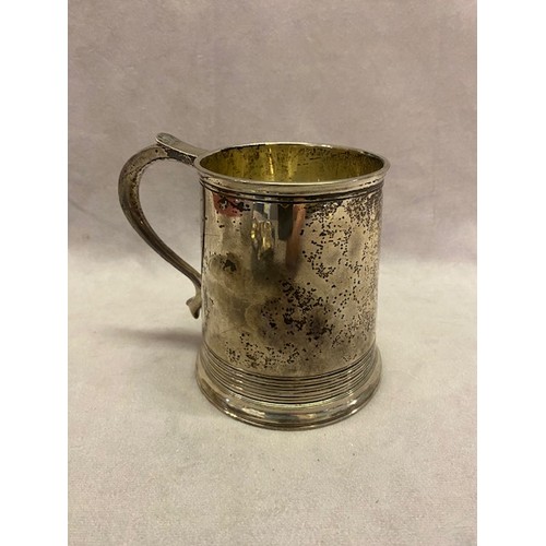 181 - A plain silver tankard with reeded base by the Goldsmiths and Silversmiths Company - London 1938