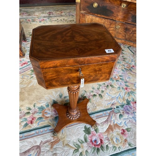 45 - A Georgian mahogany teapoy, on fluted tapering column and quatrefoil base with carved paw feet - 14i... 