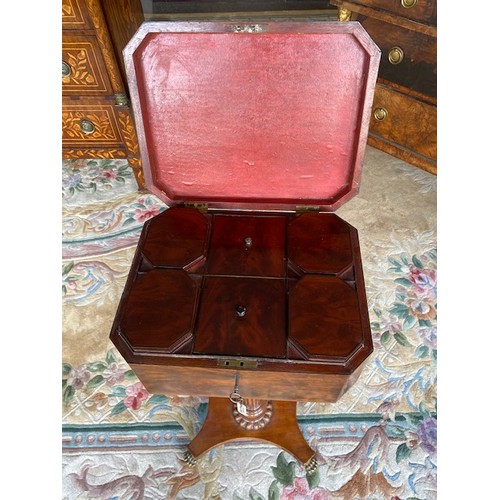 45 - A Georgian mahogany teapoy, on fluted tapering column and quatrefoil base with carved paw feet - 14i... 