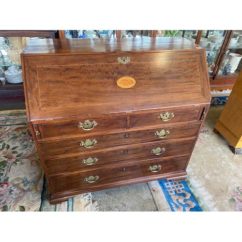 48 - A Georgian mahogany bureau, hinged fall front inlaid with shell, the interior fitted drawers and sli... 