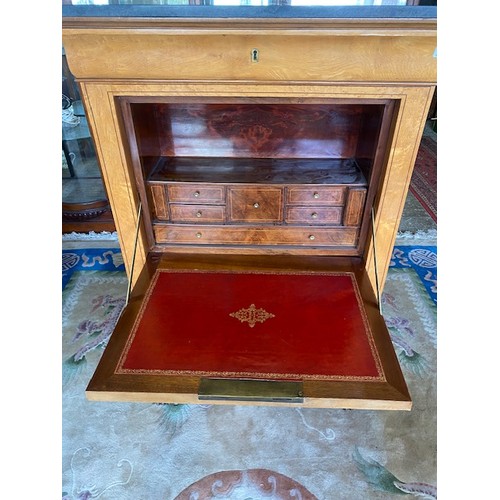 78 - A Continental maple secretaire abattant with ebony inlaid decoration to the hinged fall front, fitte... 