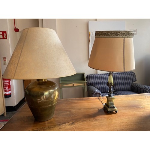 112 - An onyx and gilt metal tablelamp base, a chrome tablelamp base and a hammered brass tablelamp base w... 