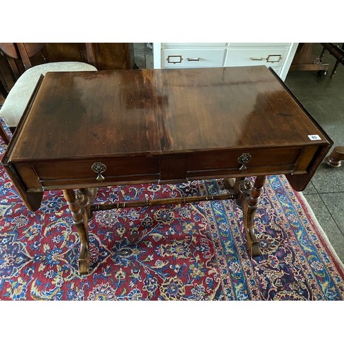 65 - A mahogany sofa table fitted two frieze drawers, on turned supports and stretchers - 36in. wide