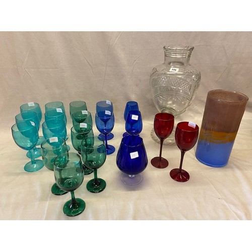 170 - A water fountain and a selection of coloured items including wines, vases etc..