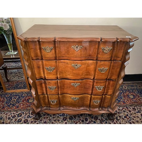 44 - A South African stinkwood chest fitted four drawers, on short cabriole legs with claw and ball feet ... 