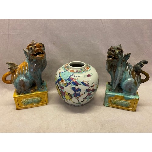 122 - A pair of Chinese dogs of Fo - 10in. high and a Chinese ginger jar - 7in. high (no lid)