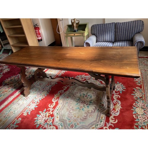 37 - An oak refectory style dining table on shaped end standards - 74in. long and a Continental oak sideb... 