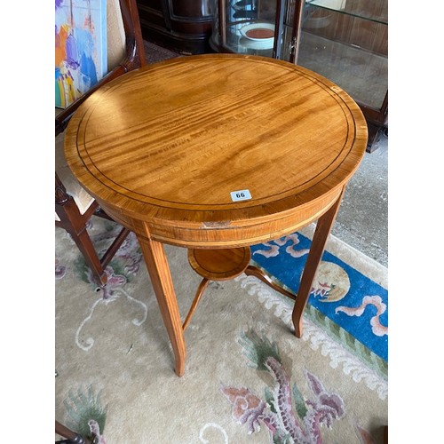 66 - An Edwardian satinwood occasional table with circular top, on tapering legs united by undertier (af)... 