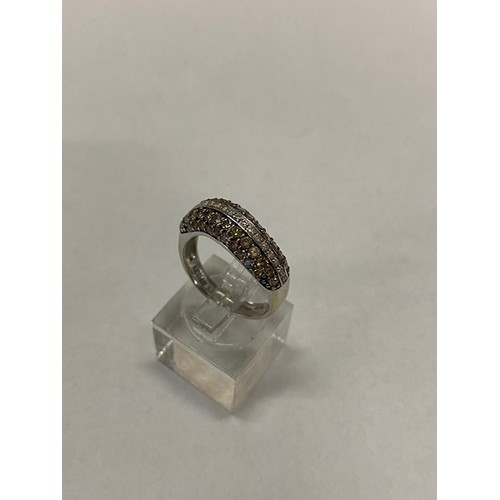 177 - A Le Vian lady's ring set alternate bands of chocolate and white pave set diamonds, on a 14kt. white... 