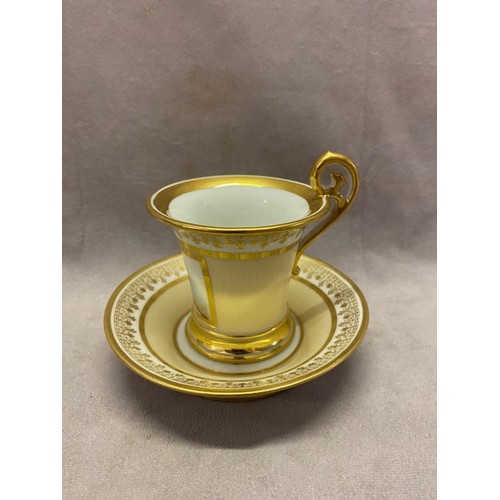 112 - A Sevres porcelain cabinet cup and saucer, the cup with gilt scroll handle, white and gilt rim, crea... 