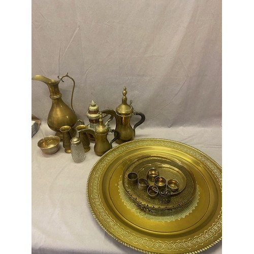 248 - A collection of brassware including two Eastern coffee pots, a Tibetan copper and white metal coffee... 