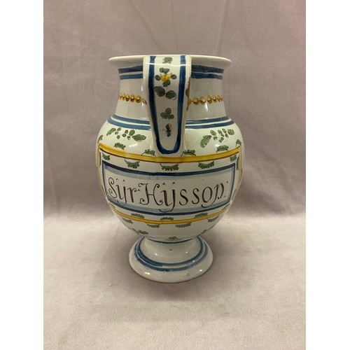 104 - A late 17th Century style Italian Maiolica pedestal wet drug jar painted in blue and ochre with flow... 