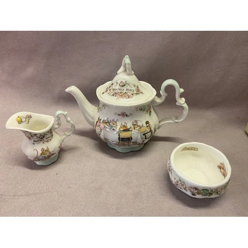 103 - A Royal Doulton Brambly Hedge miniature teapot, cream jug and sugar basin